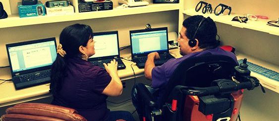 Woman and Man in Wheelchair in tech lab